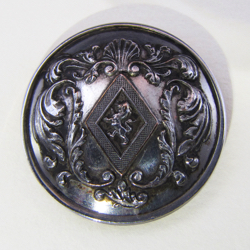 25-5.1.3 Lozenges - Maiden - rare shell & elaborate scroll design- silver-plated copper - 1 & 1/16"