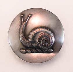 25-5.2.2.1 Animals (corresponds to Sec. 17 - Invertebrates/Mollusks) - Snail (rare) surmounting a torse - 2-piece silver-plated copper - 1 & 1/16"