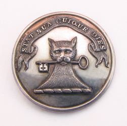 25-5.2.2.1 Animals (corresponds to Sec. 17 - Mammals/Domestic Cat) - Cat head holding a key surmounting a torse with the family motto on a banner - Canting: "Holding the key to her heart" - silverplated copper - 1" 25-5.2.2.1 Animals (corresponds to Sec. 17 - Mammals/Domestic Cat) - Cat head holding a key surmounting a torse with the family motto on a banner - Canting: "Holding the key to her heart" - silverplated copper - 1"